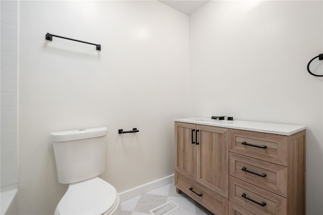 bathroom featuring vanity and toilet