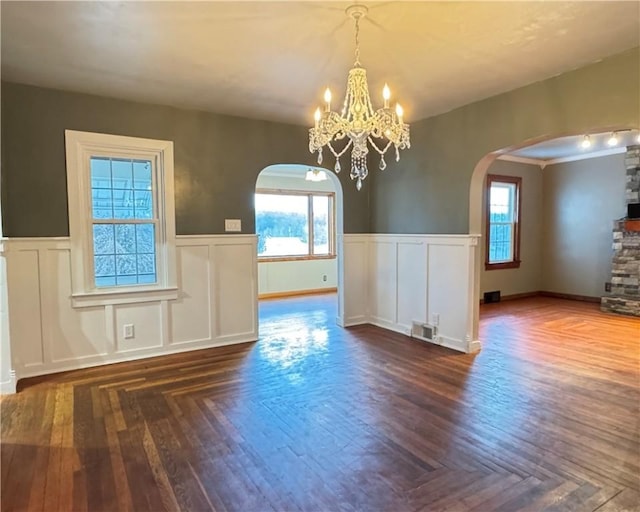 unfurnished dining area with an inviting chandelier and a healthy amount of sunlight