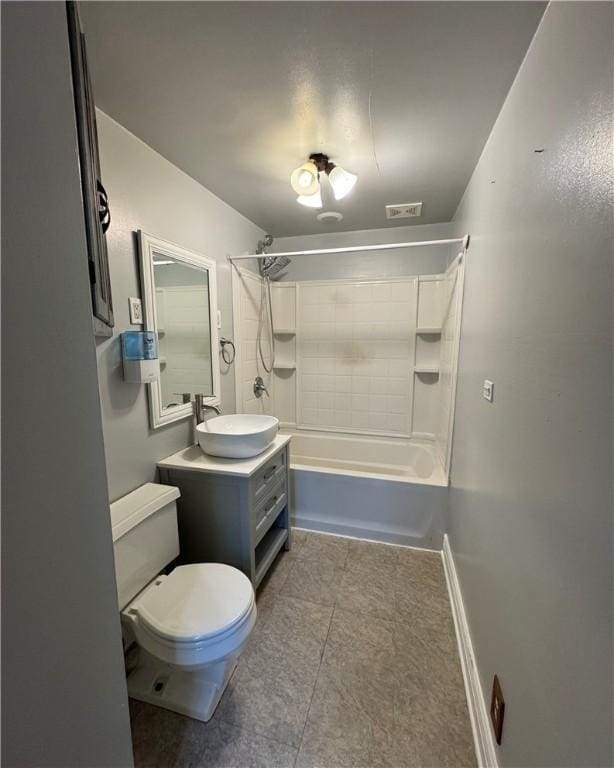 full bathroom with vanity, toilet, and tiled shower / bath combo