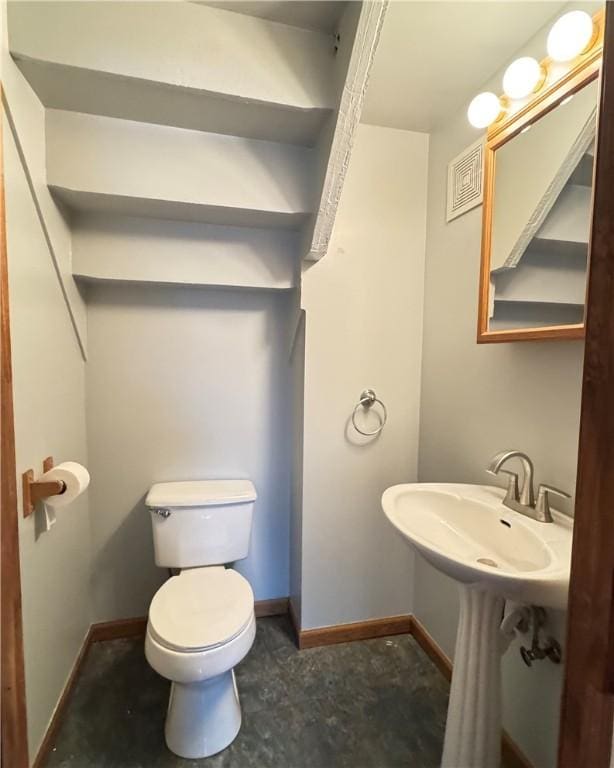 bathroom featuring toilet