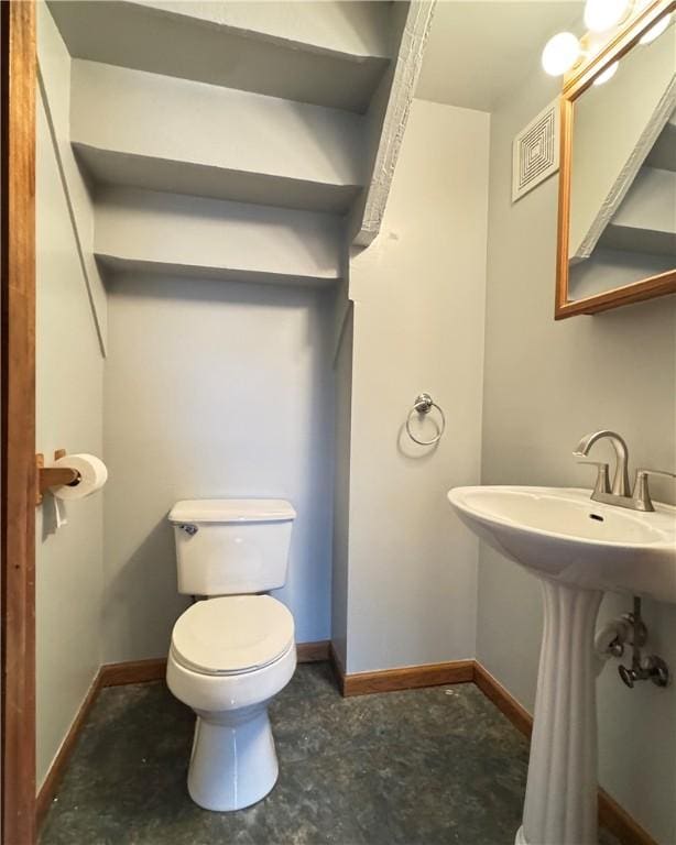 bathroom with sink and toilet