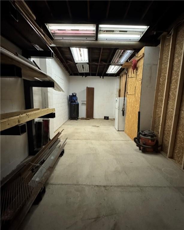 basement featuring white refrigerator