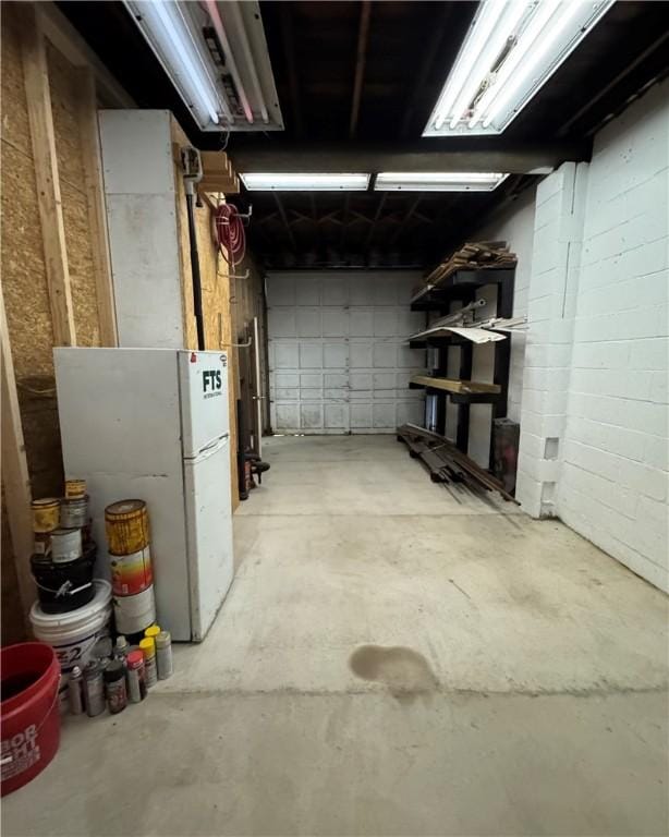 basement with white refrigerator