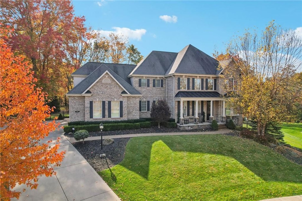 view of front of property with a front lawn and a porch