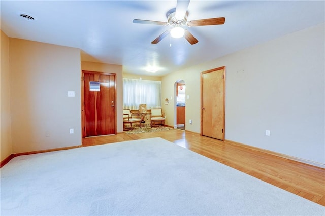 unfurnished bedroom featuring light hardwood / wood-style flooring and ceiling fan