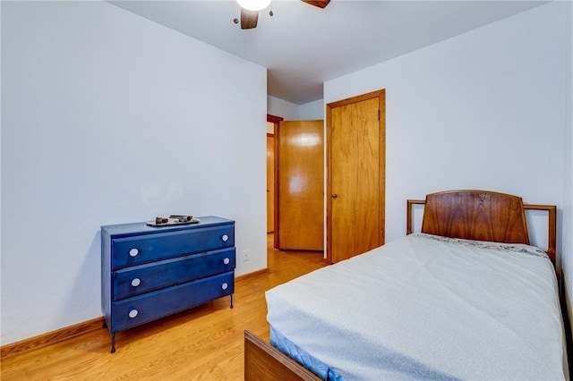 bedroom with ceiling fan and light hardwood / wood-style floors