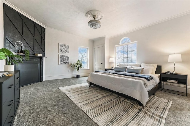 bedroom with ornamental molding, carpet flooring, and a textured ceiling