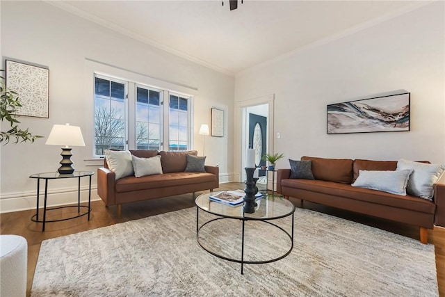 living room with dark hardwood / wood-style flooring and ornamental molding