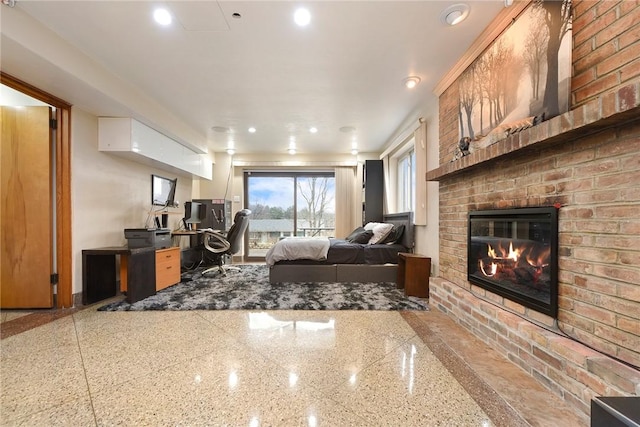 bedroom with access to exterior and a brick fireplace
