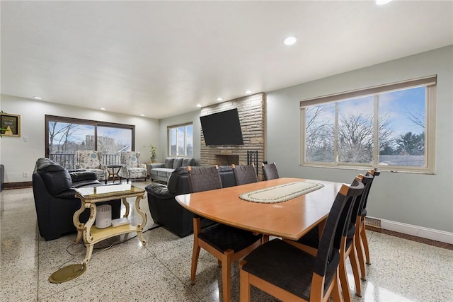 dining space featuring a fireplace