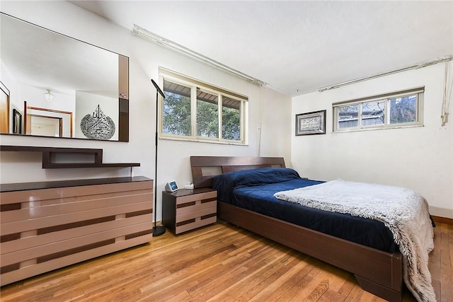 bedroom with light hardwood / wood-style flooring