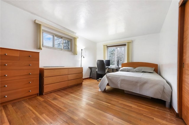 bedroom featuring light wood-type flooring