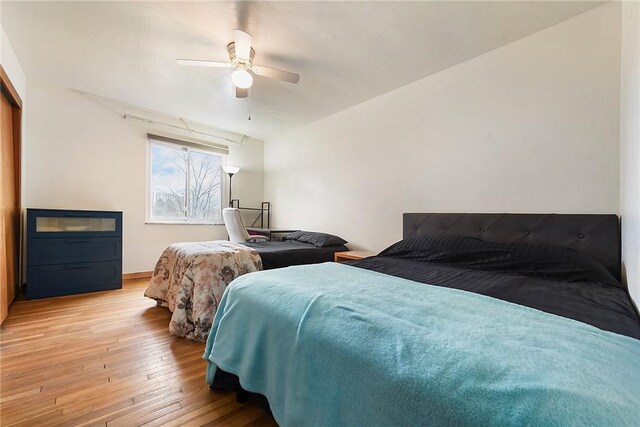 bedroom featuring ceiling fan and light wood-type flooring