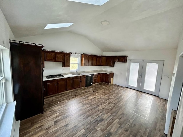 kitchen with vaulted ceiling with skylight, dishwasher, wood-type flooring, dark brown cabinetry, and french doors