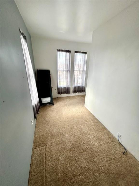 unfurnished living room with carpet floors