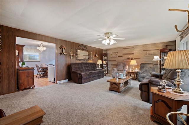 carpeted living room with ceiling fan