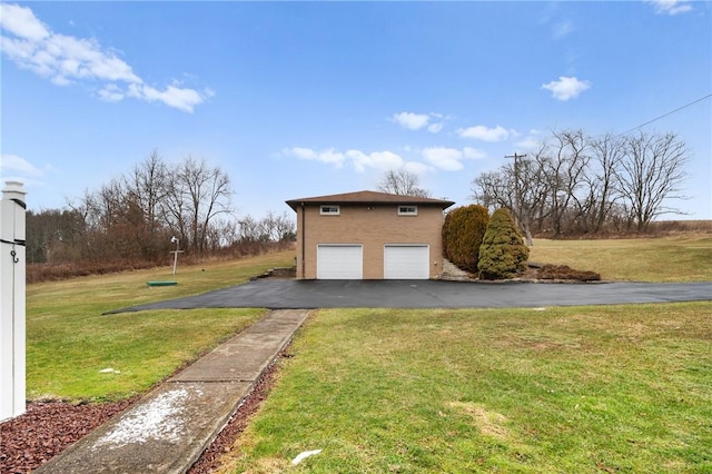 view of side of property with a lawn