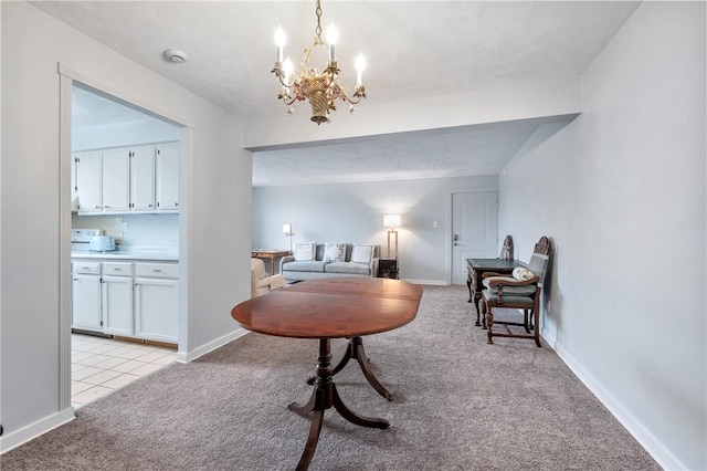 sitting room featuring light colored carpet and a notable chandelier