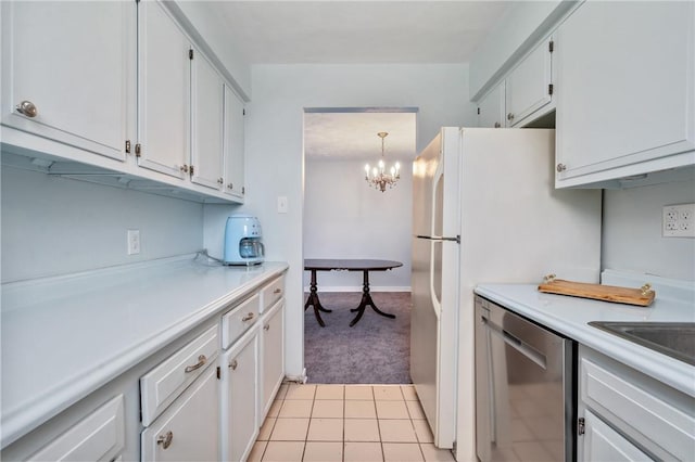 kitchen featuring white cabinetry, hanging light fixtures, light colored carpet, and stainless steel dishwasher