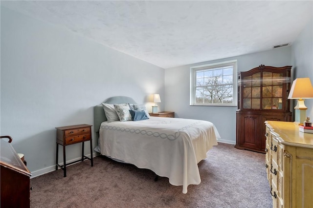 bedroom featuring dark colored carpet