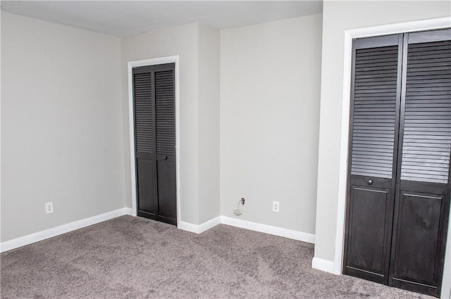 unfurnished bedroom featuring carpet floors and a closet