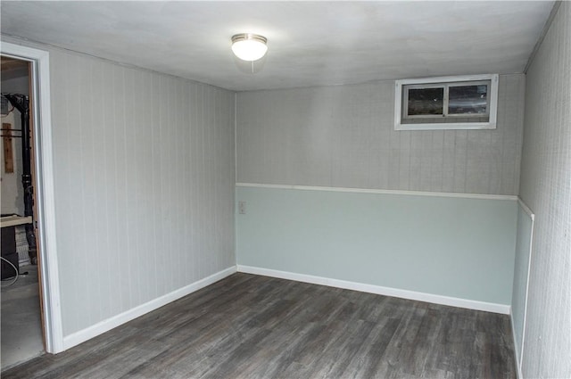 spare room with dark hardwood / wood-style floors