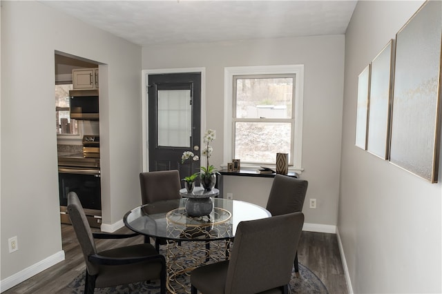 dining area featuring dark hardwood / wood-style floors