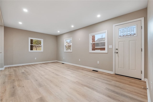 entrance foyer with light wood-type flooring