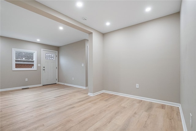 spare room featuring light hardwood / wood-style flooring