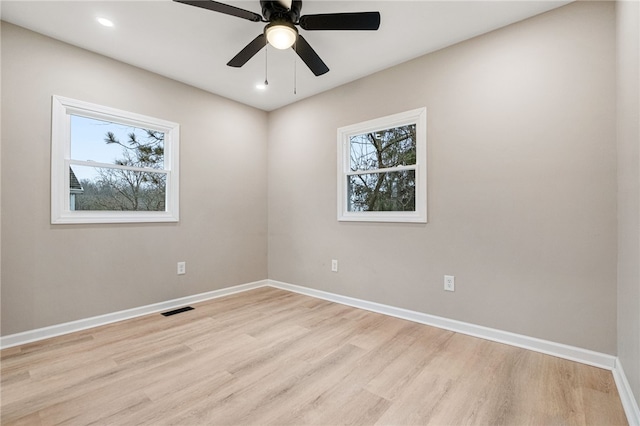 unfurnished room with ceiling fan and light hardwood / wood-style floors