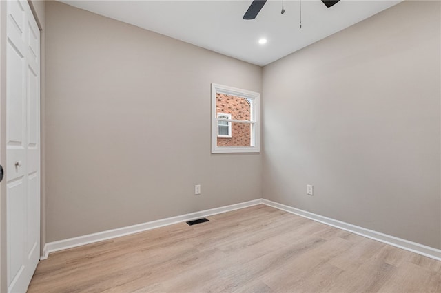 empty room featuring light hardwood / wood-style flooring and ceiling fan