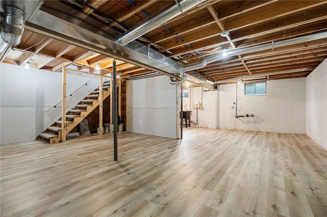 basement with hardwood / wood-style flooring