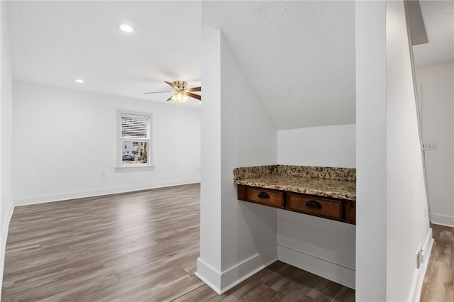 bathroom with recessed lighting, a ceiling fan, a textured ceiling, wood finished floors, and baseboards