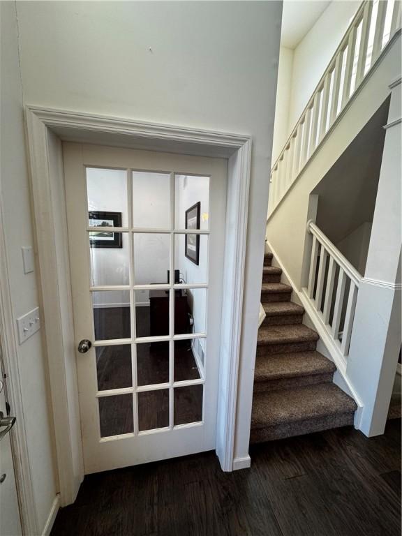 interior space with dark hardwood / wood-style floors