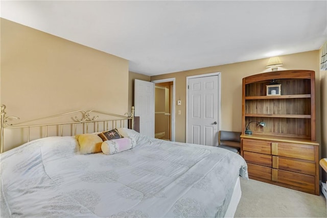 bedroom featuring light carpet