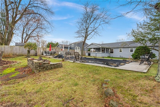 view of yard featuring a wooden deck and a patio