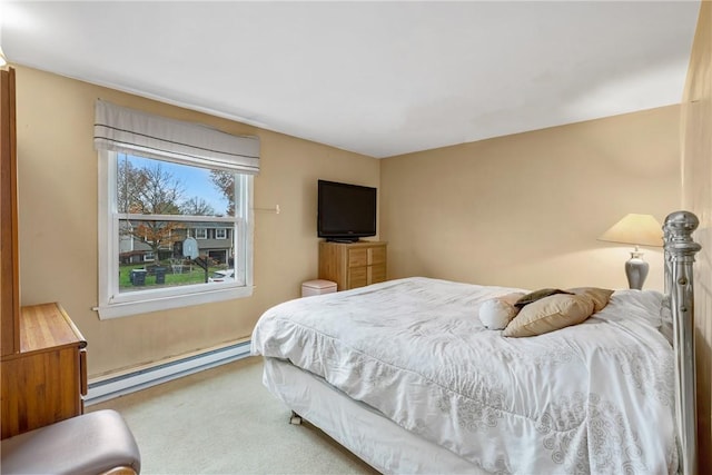 bedroom with a baseboard radiator and carpet floors