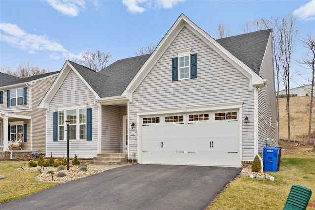 view of front property with a garage and a front yard