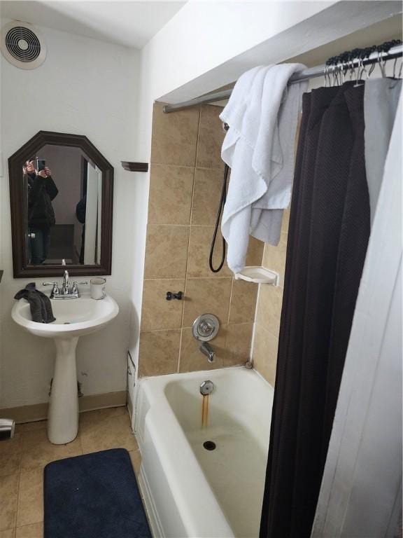 bathroom featuring tile patterned floors and shower / bath combo