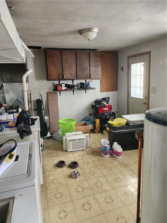 kitchen with washer / clothes dryer and dark brown cabinets