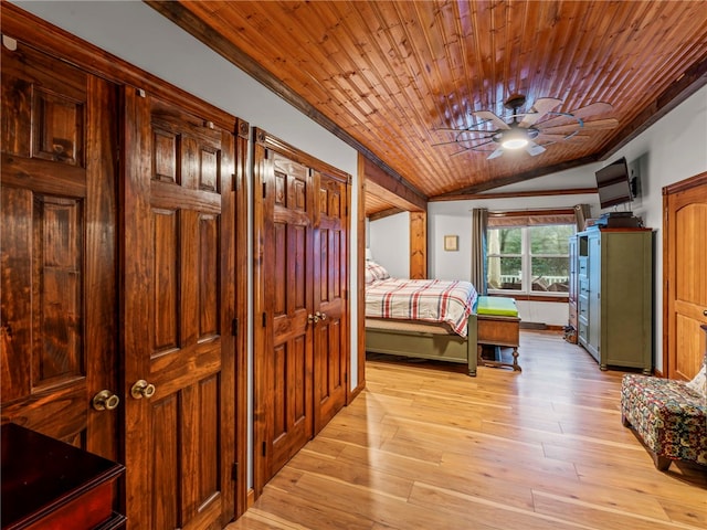 bedroom with ceiling fan, wooden ceiling, vaulted ceiling, and light wood-type flooring