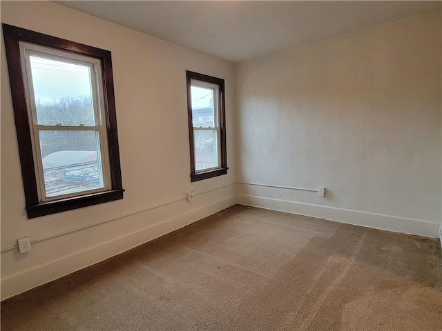 unfurnished room with carpet flooring