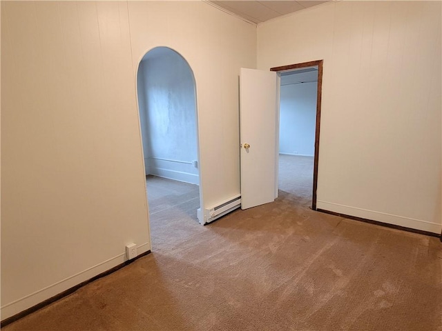 unfurnished room with a baseboard radiator and light carpet