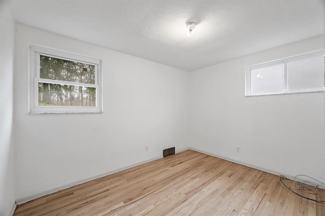 spare room featuring light hardwood / wood-style flooring