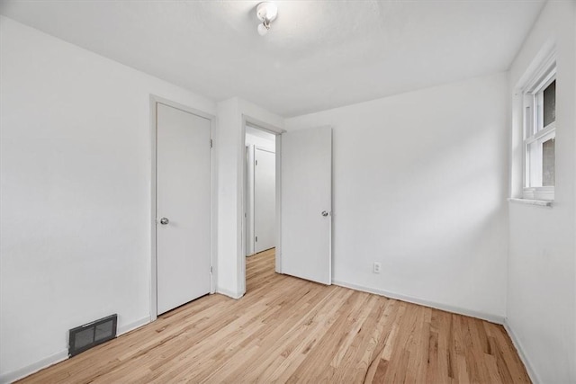 unfurnished bedroom featuring light hardwood / wood-style floors