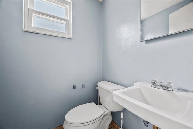 bathroom with sink and toilet