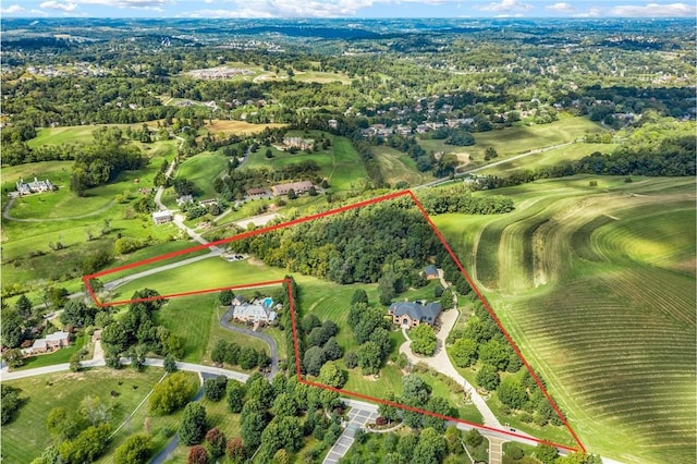 birds eye view of property with a rural view