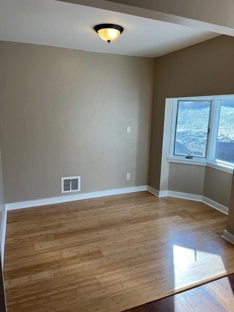 unfurnished room featuring light hardwood / wood-style floors