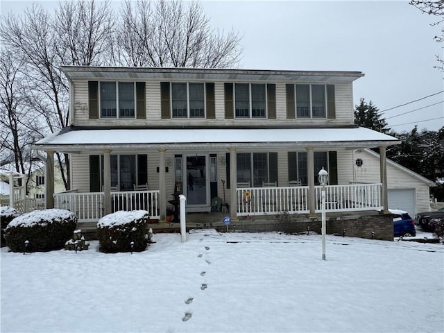 view of front facade with a garage and a porch