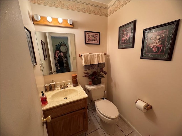 bathroom with tile patterned floors, vanity, and toilet